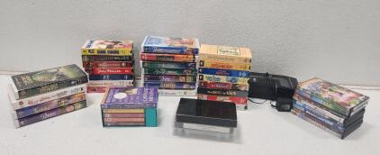 (29) Assorted VHS Tapes (8) Assorted DVDs (5) Assorted Audio Cassette Tapes (1) Cassette Tape Player