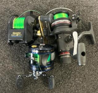 (3) Fishing Reels Including (1) Anbassadeur, (1) Quick Fire 2, And (1) Quantum Trophy