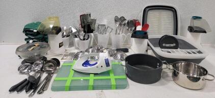 (6) Glass Cutting Boards, taped together ((3) Air Poppers, 1 missing top *all tested* (2) Collapsible Dish Drying Racks (1) GE Clothes Iron W/Retractable Cord (1) Microwave Popcorn Popper (5) Collapsible Steamers (12) Green Pot Holders (1) Osterizer Blend