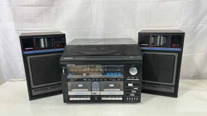 (1) Soundesign AM/FM stereo Receiver W/ A Clock, Dual Cassette Deck, And Turntable (2) Soundesign SX-12 stereo loudspeaker