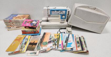 (1) Vintage Dressmaker Brand Sewing Machine W/ Carrying Case (12) Popular Photography Magazine 1972-1975 And Assorted Travel Brochure Maps And Books