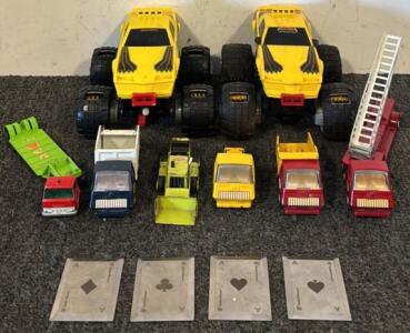 (2) Vintage Galoob &ldquo;Animal&rdquo; Toy Monster Trucks, (5) Vintage Tonka Toy Trucks, (1) Vintage Goodyear Toy Truck, & (4) Stainless Steel Smith & Wesson Throwing Cards