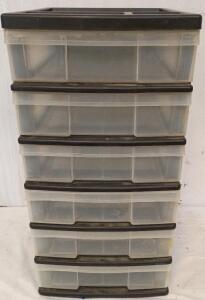Six-Drawer Plastic Storage Unit. It is a Multi-Purpose Organizer With Clear Drawers and a Black Frame. 25"x17"x13"