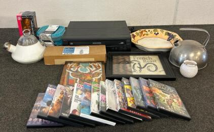 (14) DVDs, (1) Philips Magnavox 5-Disc Carousel CD Changer, (1) Limited Edition Couch Mariuchi, And More