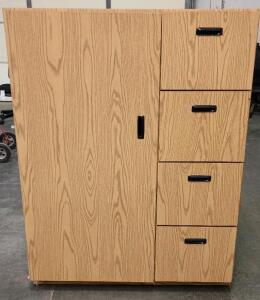 This is a Wood Grain Cabinet With a Single Door and Four Drawers. Used In An Office or A School Setting 56"x42"x19"