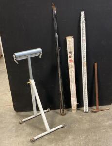 Vintage Pickaxe, CST Berger Survey Leveling Rod, Adjustable Roller Stand, Box Of Welding Electrodes And More