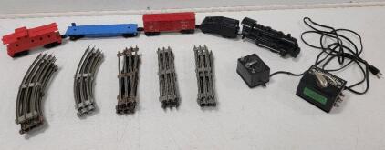 Collection of O-gauge Model Train Components from a Lionel "Blue Streak" Freight Set Includes Engine "1061" w/Coal Tender, Red Box Car, Blue Flat Car and Red Caboose. (1) Vintage Louis Marx & Co. No. 1249 Toy Train Transformer, damage to cord, see photos 
