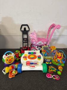 Variety Of Baby Toys Including Fisher-Price, Princess Stroller, And More