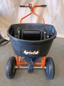 Agri-Fab 130 lb. Push Broadcast Spreader (model 45-0462). This Spreader is Designed for Spreading Fertilizer, Seed, or Ice Melt over Large Areas.