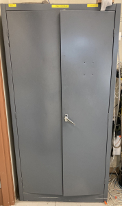 Metal Cabinet with Miscellaneous Items In It