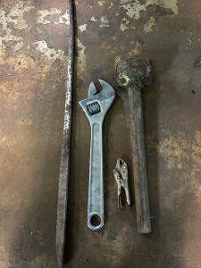 (1) 3&rsquo; Pry Bar (1) 18&rdquo; Cresent Wrench (1) Homemade Steel Mallet (1) Vise Grip Locking Pliers