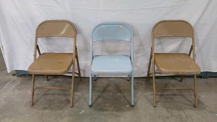 (2) Gold Folding Chairs (1) Blue Folding Chair - 17"L x16"W x30"H