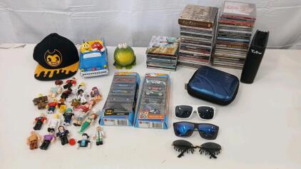 (52) CDs Including Garth Brooks And Jimmy Buffett (1) M&M's Cermaic Hotrod (3) Sunglasses & More