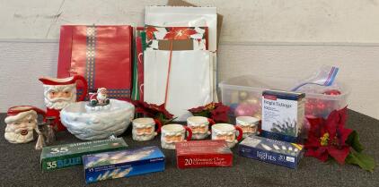 (6) Santa Mugs And Pitcher, (5) Boxes Of Lights, Gift Boxes, Ornaments, (2) Silver Angel Candlestick Holders And More