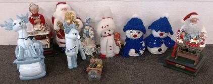 (2) Knitted Snowmen, (2) Ceramic Vintage Blue Deer, Santa And Mrs Claus Figure Stands, And More