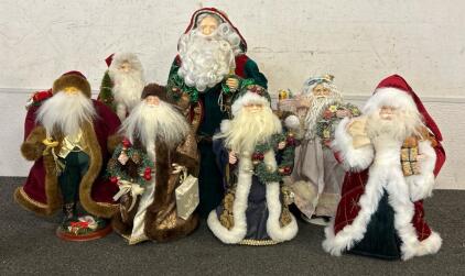 (7) Various Sizes Of Ceramic Santa Statues
