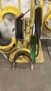 Pressure washer hoses, gun, hose reel on heavy duty metal stand