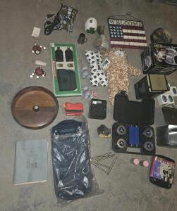 ( OFFSITE) Household goods and collectibles.A plush dog toy, an American flag, and a box for an AM/FM cassette & More .
