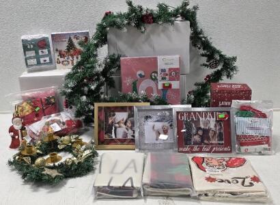 Holiday Decor and Accessories (12) 18" Square Holiday Pillow Covers (3) 5" x 7" Holiday Photo Frames (3) 9-Foot Decorated Pre-Lit Garland *NEW*1 box opened to photo and test* (1) 5-Pack Gift Boxes (1) 12-pack Felt Stockings (2) Ladies Christmas Leggings, 