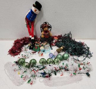 (1) Vintage Black Cast Iron Doll Chair (1) Glass Rocking Reindeer Figurine And Assorted Holiday Lights, Ornaments, And Garlands