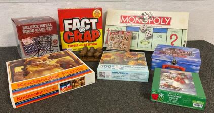 Vintage Monopoly, Deluxe Metal Bingo Cage Set, (4) Puzzles, Tic-tac-toe, Fact Or Crap, Are You Smarter Than A Fifth Grader,(5) DVDs, Spirograph (2) PlayStation 3 Games, (1) PlayStation 2 Game, And (1) PS3 Game