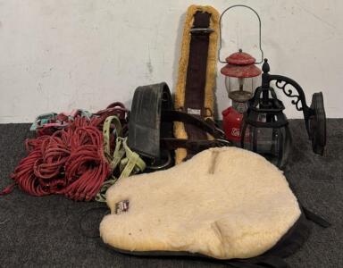 Various Harnesses, (2) Horse Girths, (1) Foam Cushion for Saddle, Coleman Lantern, & Wall Mounted Lantern