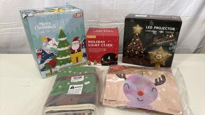 Assorted Christmas Decor & Items - (1) 7.5&rsquo; Inflatable Christmas Tree , (1) Inflatable Raindeer Ornament (1) Box Of Holiday Light Clips (1) LED Gold Star That Projects onto Ceiling (1) Pack Of 2 Holiday Pillow Cases