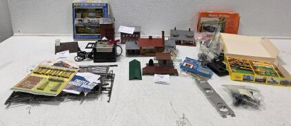 Lionel Train Lot (1) Faller Train Station (1) Box of Bridge Trestel Parts (1) Pola Train Station (1) Lowenbrau Train Station (1) Lionel Transformer