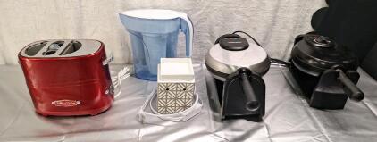 (1) Hot Dog Toaster, (2) Belgian Waffle Makers (1) Scented Wax Warmer & (1) Filtered Water Pitcher