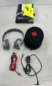 (1) Monster iSport Intensity In-Ear Headphones,(1)Beats by Dr. Dre Solo HD wired on-ear headphones in a white and gray .