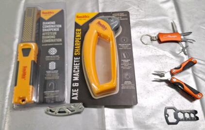 (1) Smiths Diamond Combination Sharpner, (1) Smiths Axe & Machete Sharpner, (1) Gerber Pocket Knife & (3) Olympia Pocket Multi Tools