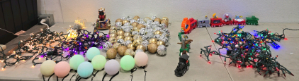 Vintage musical Santa Claus figurine in a rocking chair,Assorted gold and silver Christmas ball ornaments,(1)Holiday Express Train toy set,Multi -Color Christmas Lights ,(1) Set Of white LED string lights, also known as fairy lights,(15) Point Grow LightB