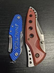 (1) Circle SH Cutlery Red Folding Knife CSH-210RD,(1)Blue Nautica brand multi-tool pocket knife.<br/>It is a compact, multi-functional tool featuring various implements like a knife blade, screwdriver, and possibly a corkscrew or other tools.