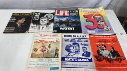 (2) 63-64 JFK History Magazines (1) 1981 Life Magazine W/The Royal Wedding Preview (1) Discount Store News 30 Years Of Kmart (1) 1959 Sound Of Music Sheet Music (1) 1960 North To Alaska Sheet Music (1) 1965 Doctor ZHiVAGO Theme Sheet Music