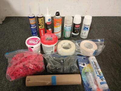 Assorted spray paints, silicone and adhesive caulking. Spackle and drywall tape. Assortment of shims for tile and laminate flooring.