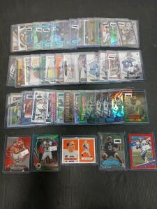 (50) Assorted Football Cards Including Prizm, Donruss And Fleer Travis Kelce, Barry Sanders In Plastic Hard Cover