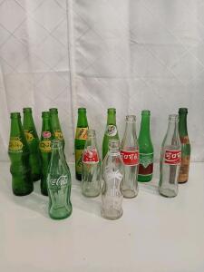 (4) Vintage Quiky Soda Glass Bottles (3) Vintage Overseas Coca-Cola Glass Bottles (5) Assorted Vintage Glass Bottles