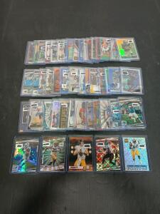 (50) Assorted Football Cards Including Topps, Fleer And Donruss Kenny Pickett, Aaron Jones In Plastic Hard Cover
