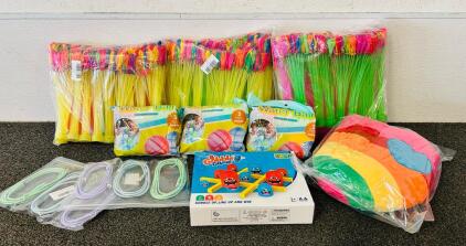 (3) Packs Water Balloons, (3) Bags Of Silicone Water Balls, Gobble Game, Charging Cables, And Rainbow Plush Pillow