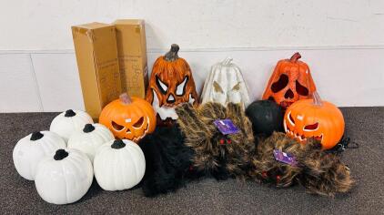 Halloween Decor Including: Light Up Pumpkins, White and Black Mini Pumpkins, Witch Legs, and Furry Flexible Spiders