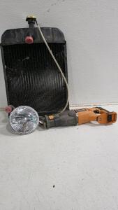 (1) Agvantage AM8N8005 Radiator, (1) Ridgid Jigsaw, & (1) 7" Lightbulb