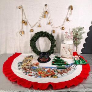 (1) 6' Metal Bell Garland String (1) 18" Artificial Wreath, (1) Christmas Tree Skirt & (1) Lighted Acrylic Snowman Family