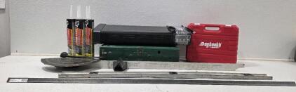 (1) Coleman 413E Camp Stove, Green(1) Vintage Moorekiln Drying Guide (1) *Like New* Dogtooth Angle Grinder w/2 Batteries (1) 4ft. Level (5 tubes) Dap 4000 Subfloor Construction Adhesive (1) Holmes Eco-Smart Space Heater, *tested* must be horizontal to wor
