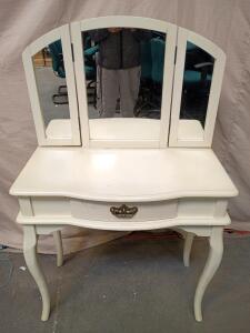White Wooden Vanity With a Tri-Fold Mirror and a Single Drawer. 31"x32"x15" Total Height is 51"