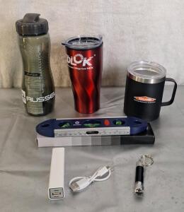 (1) 9" Torpedo Level, (1) 2200mhA Power Bank, (1) Mini LED Flashlight, (1) 15-Oz Stainless Steel Insulated Mug W/ Lid, (1) 20-Oz Stainless Steel Mug W/ Lid & (1) 20-Oz Water Bottle