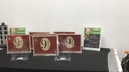Plastic Display Pamphlet Holders and Card Holders with Platform 9 3/4 Signs