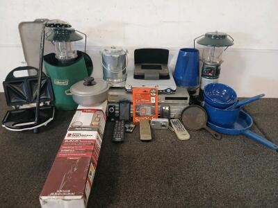 Various Camping Accessories, Electronics, & Cook Ware Including (2) Coleman Propane Lanterns (One With Cracked Glass), (1) Sandwich Toaster, (3) DVD Players & More