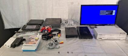 (1) 23" Sanyo LCD TV, (1) Sylvania VHS Player, (2) Nintendo Wii Consoles, Assorted Controllers, Cables & More