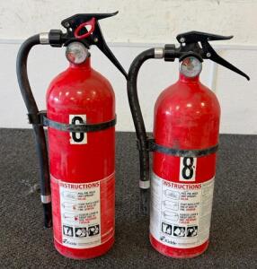 (1) Full Fire Extinguisher And (1) Empty Extinguisher