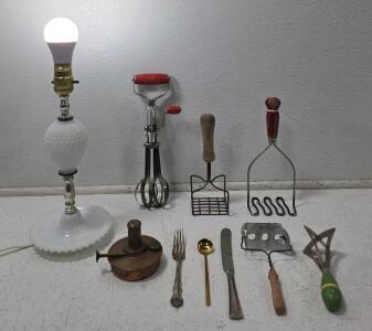 (1) Vintage White Hobnail Milk Glass Table Lamp *tested* (1) Vintage Hand Mixer w/Stainless Steel Beater TAPLIN MFG CO. Red Handle (1) 1906 Antique Patinated Copper Brass Oil Lamp, PATD. MAR 20 1906 July 17, 1906 (2) Antique Potato Mashers (1) Vintage A&